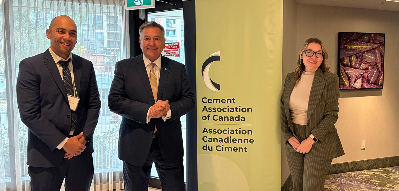 Sy Steppacher and Emma Schindler (Ash Grove Cement, a CRH Company) with Charles Sousa, MP for Mississauga-Lakeshore.