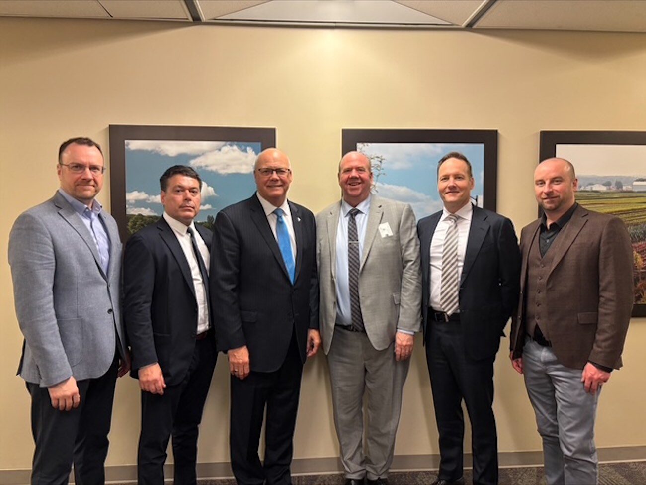 Andrew Stewart (Amrize), Lino Dinis (Heidelberg Materials), Bart Kanters (Concrete Ontario), CAC President Adam Auer, and Richard Sluce (Ash Grove Cement, a CRH Company), with Minister of Municipal Affairs and Housing of Ontario Rob Flack.